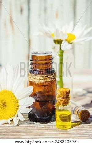 Chamomile Essential Oil. Selective Focus. Butle Little.