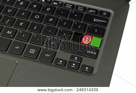 Flag Of Afghanistan On Laptop Keyboard, Close-up.