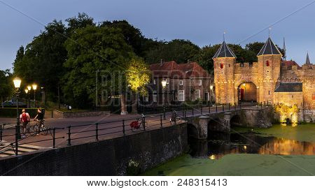 Amersfoort, The Netherlands - June 28, 2018: Koppelpoort In The Evening With Some People At The Old 