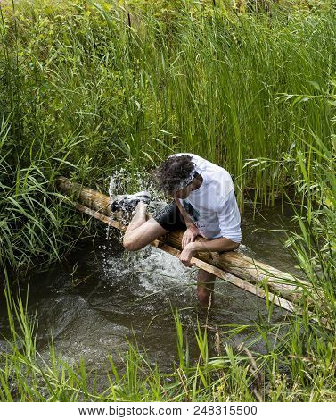 Biddinghuizen, The Netherlands - June 23, 2018: Man During A Mud Run (mudraise, Charity) In The Mud 