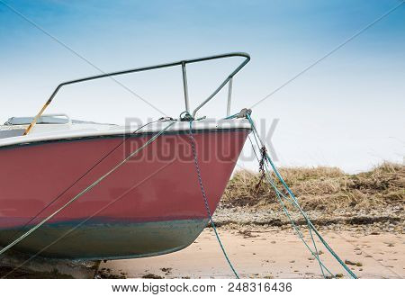 Bow Of Sail Yaght Moored At Low Tide