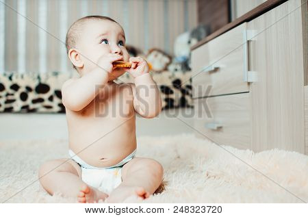 Adorable Baby Eating A Cookie