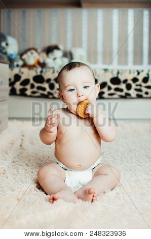 Adorable Baby Eating A Cookie