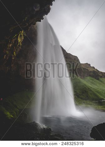 Seljalandsfoss Waterfall In Iceland Passage Under The Waterfall Long Time Exposure, Vertical Water