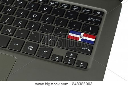 Flag Of Dominican Republic On Laptop Keyboard, Close-up.