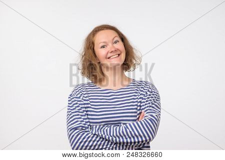 Smiling European Lady In Marine Pulover Looking At Camera, Isolated On Gray Background. Be Self Conf