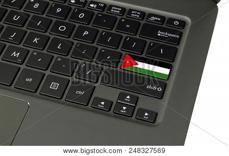 Flag Of Jordan On Laptop Keyboard, Close-up.