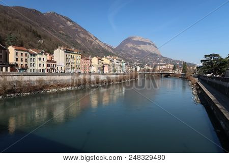 Buildings Of Different Shapes And Colors Along The Isère River In Grenoble, France