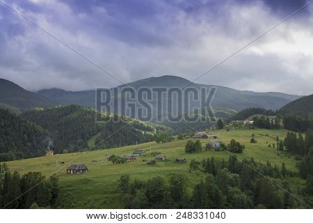 Photo Of Misty Morning Fog At The Sunrise In The Mountains. Ukraine, Carpathians, Dzembronia Village