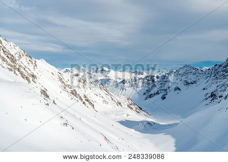 Mountain View During Winter In Switzerland With Blue Sky