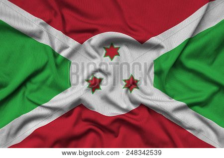 Burundi Flag  Is Depicted On A Sports Cloth Fabric With Many Folds. Sport Team Waving Banner