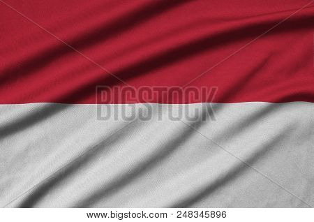 Indonesia Flag  Is Depicted On A Sports Cloth Fabric With Many Folds. Sport Team Waving Banner