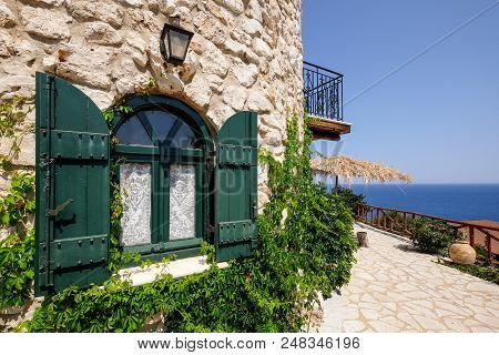 Vintage Green Window On A Brick House With Ocean Background, Zakynthos, Greece