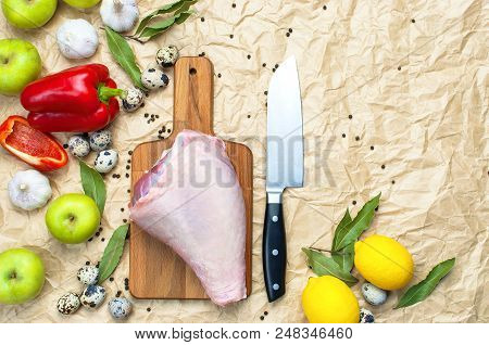 Raw Turkey Thigh Garlic Apples Lemon Red Bell Pepper Quail Eggs Spices On A Wooden Board. Top View O