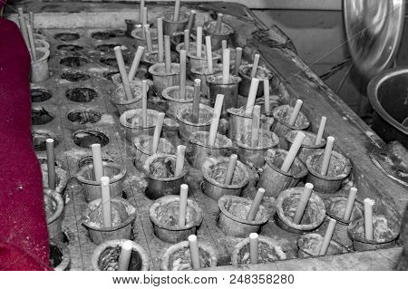 Kulfi Steel Cones With Sticks In Them