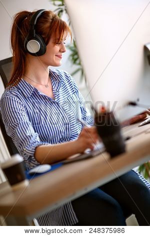 Female graphic designer on job in office