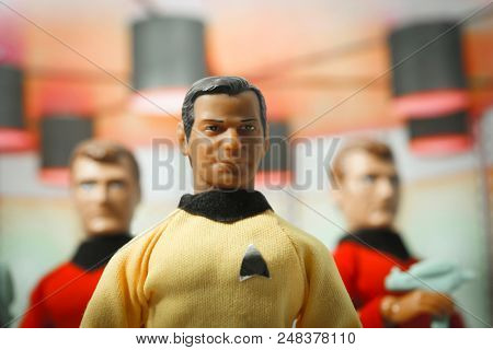 JUL 5 2018: Recreation of a scene from the 1960s television science fiction show Star Trek, where Captain Kirk and 2 red shirts beam down to the planet surface - Mego style action figures