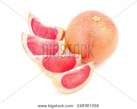 Ripe Grapefruit With Its Fragrant Red Slices Is Situated On The White Background.