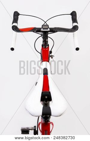 Upper View Of Professional Carbon Road Bike From Saddle Perspective. Over White. Vertical Image Comp