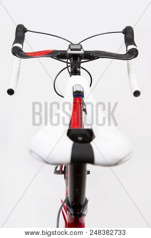 Sport Concepts. Upper View Of Professional Carbon Road Bike From Saddle Perspective. Over White. Ver