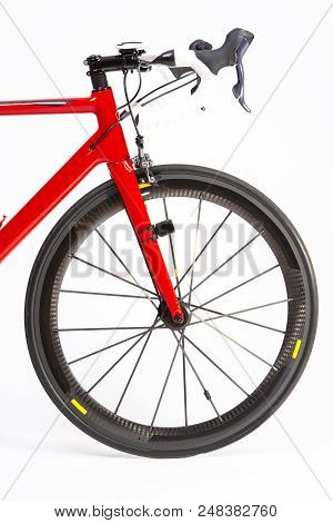 Cycling Sport Concepts. Closeup Of Professional Road Bike With Deep Carbon Rims Wheelset. Vertical I