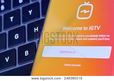 New York, Usa - July 6, 2018: Open Igtv App  On Smartphone Screen Lay On Laptop Keyboard