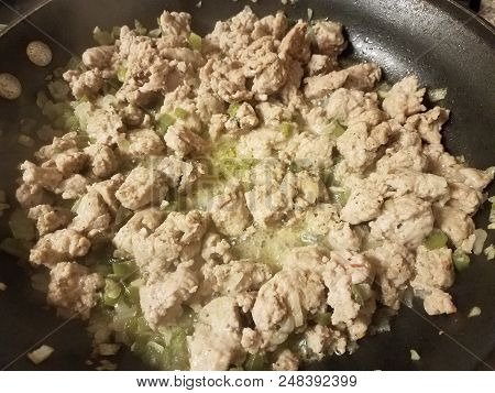 Seasoned Ground Turkey Meat Sizzing In A Frying Pan With Green Peppers