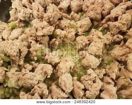 Seasoned Ground Turkey Meat Sizzing In A Frying Pan With Green Peppers