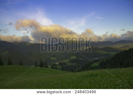 Photo Of Mountain Landscape In The Summer Under Beautiful Cloudy Sky. Ukraine, Carpathians, Dzembron