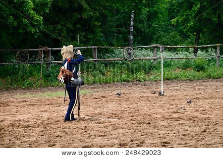 Cavalryman Shoot Standing In The Sand, Forest In The Background