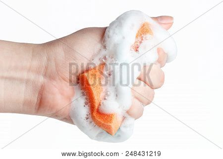 Hand Grasps Sponge For Washing Dishes On White Background
