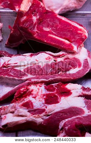 Raw Meat Beef Tray Portion Chunks Three Fillets With Bone Preparation To Grill Steaks