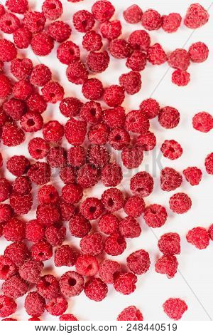 Dripping Raspberry On White Background. Close-up Photo.