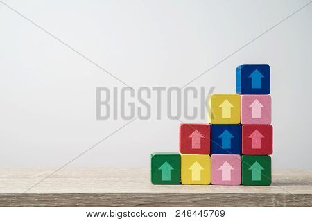 Leadership And Growth Concept With Arrows On Wooden Blocks Stairs. Business Background