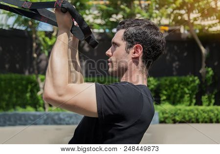 Middel Man Exercise With Elastic Rope Outdoor For Healthy. Sport Exercise Concept.