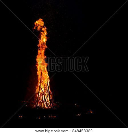 Midsummer Night. Young People In Slavic Clothes Sitting Near The Bonfire.