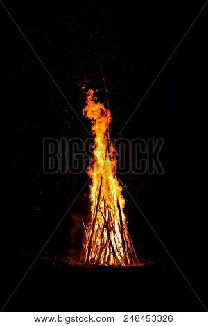 Midsummer Night. Young People In Slavic Clothes Sitting Near The Bonfire.