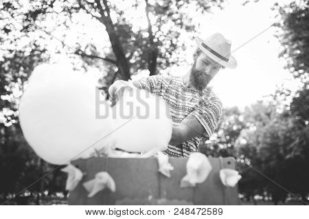 Photo Theme Small Business Cooking Sweets. A Young Man With A Beard Of A Caucasian Trader In The Hat