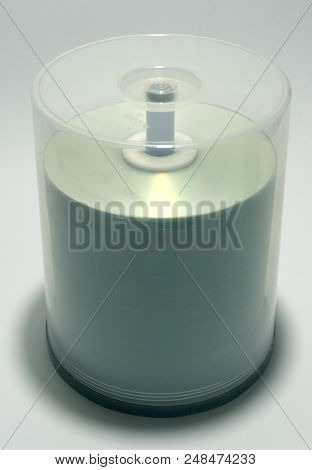 Stack Of Blank Discs In Storage Case On Spindle. Capacity Of Plastic Tube Is Up To Hundred Cds