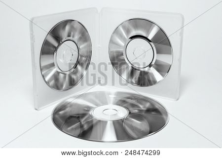 Case For Mini Cds. Inner Trays Of Double-sided Semitransparent Plastic Box With Iridescent Discs On 