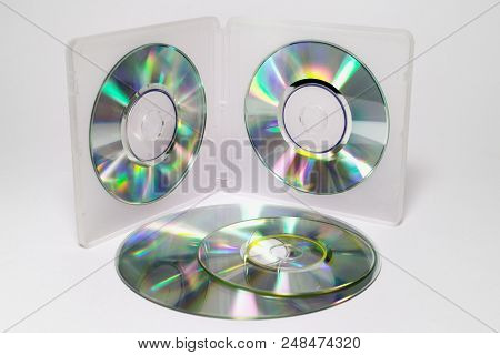 Case For Mini Cds. Inner Trays Of Double-sided Semitransparent Plastic Box With Iridescent Discs On 