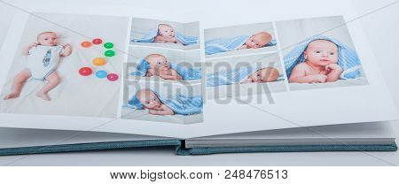 High Angle View Open Book With Album At Home.