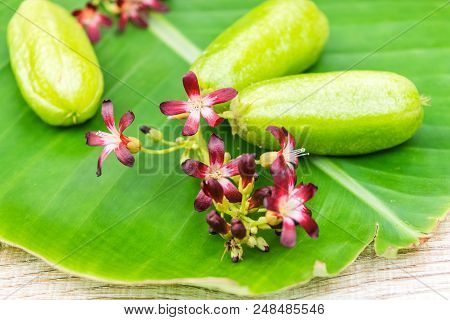 Averrhoa Bilimbi Fruit With Flowers On Banana Leaf
