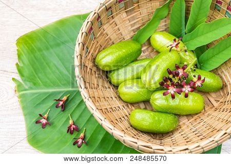 Averrhoa Bilimbi Fruit With Flowers On Banana Leaf