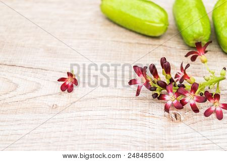 Averrhoa Bilimbi Fruit With Flowers And Leaf On Wood Background