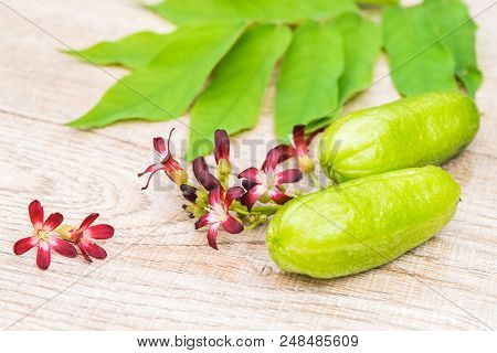 Averrhoa Bilimbi Fruit With Flowers And Leaf On Wood Background