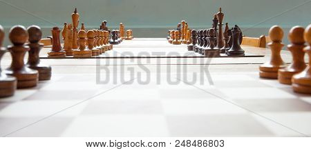 Wooden Chess Board With Wooden Chess Pieces.
