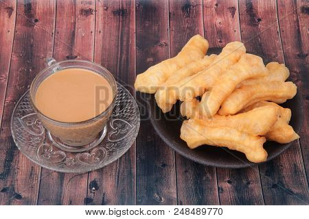 Ready Served Of A Cup Of Coffee And Patongko (deep-fried Dough Stick)