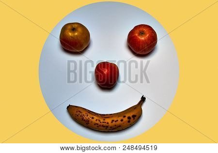 Minimalist Round Fruit Face Made Of Apple, Peach And Banana.