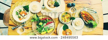 Table Top View Thai Traditional Cuisine. Pad Pak Ruam Mitr Stir Vegetables. Red Curry Chicken Coconu